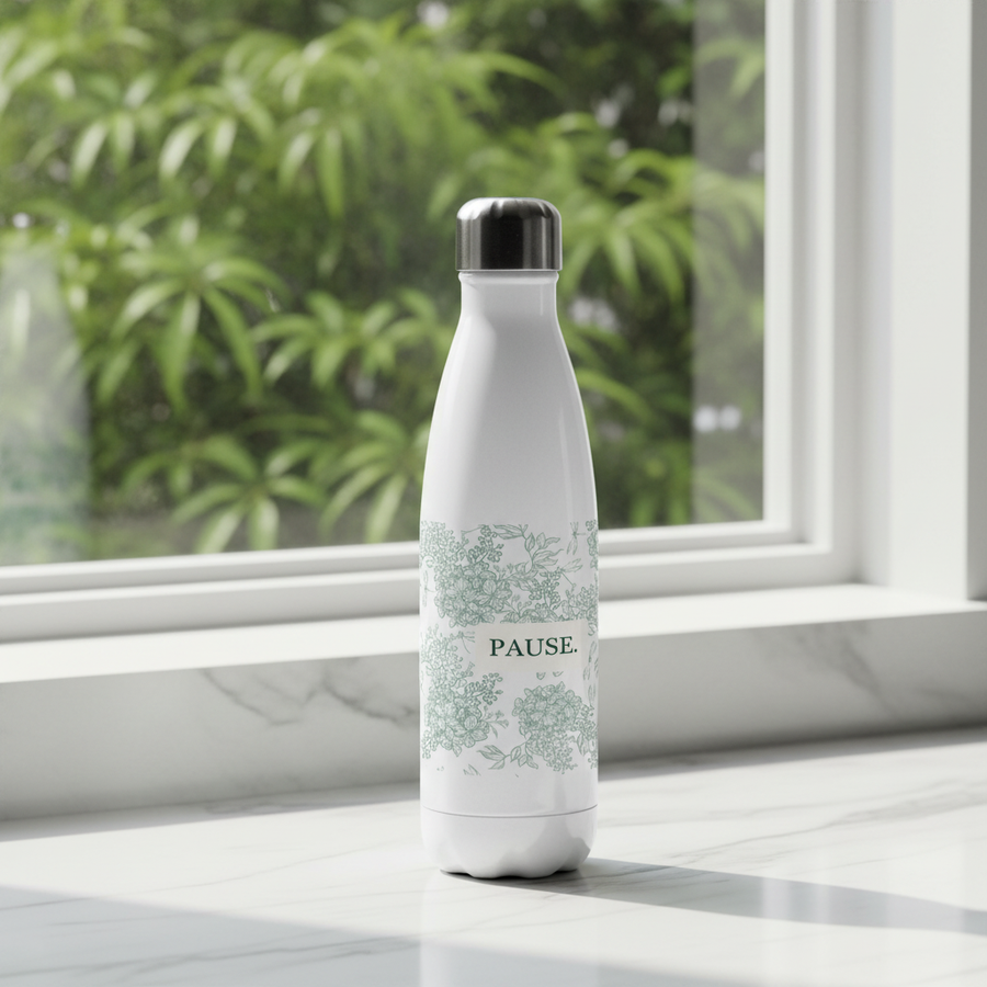 LIMITED EDITION PAUSE bottle in a calm serene setting with natural light and greenery