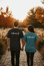Couple wearing dark ODAAT tees