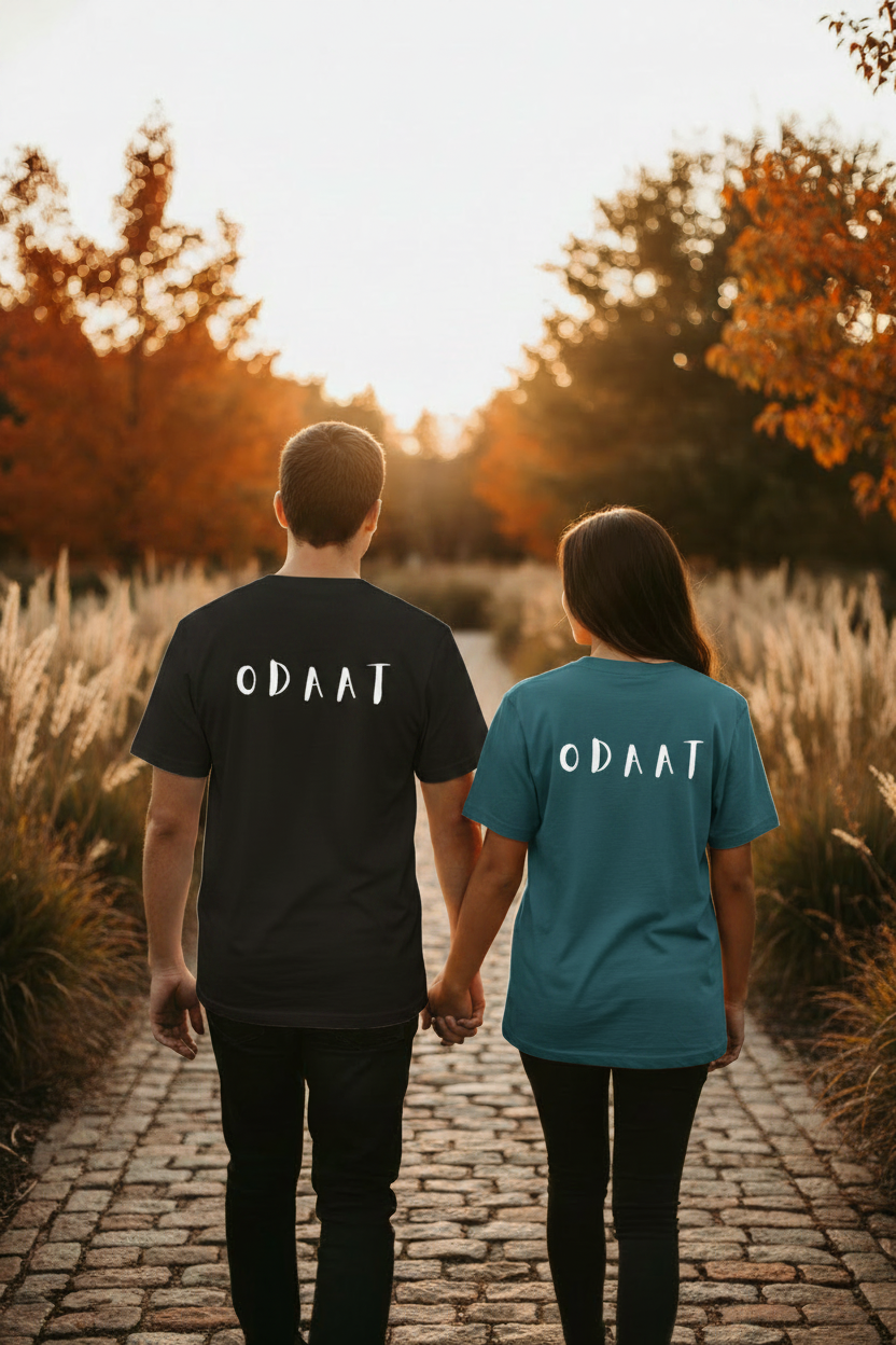 Couple wearing dark ODAAT tees